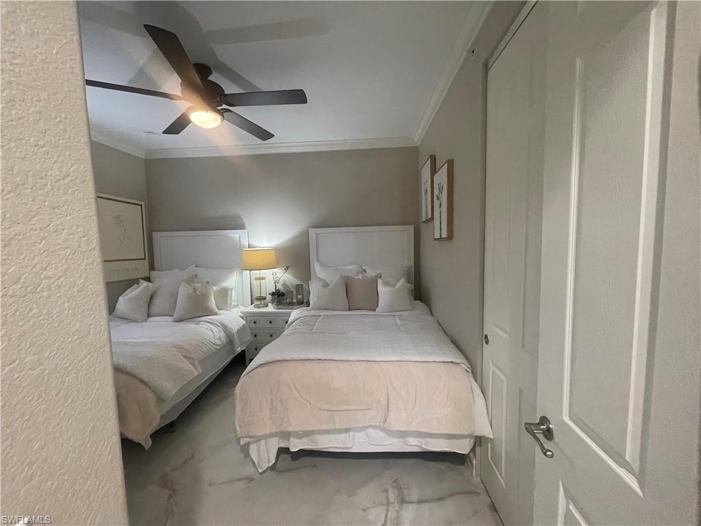 Bedroom featuring ornamental molding and ceiling fan