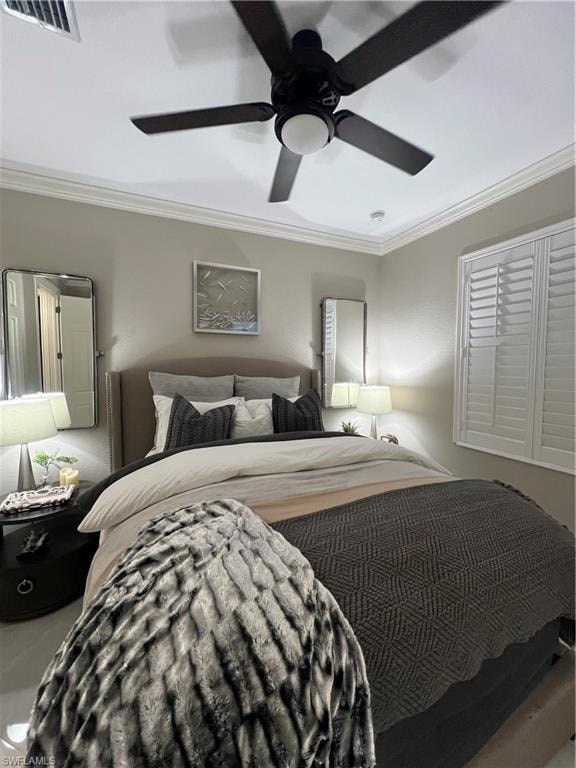 Bedroom featuring crown molding and ceiling fan