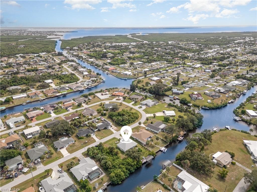 View of property location with nearby suburban area and a nearby body of water