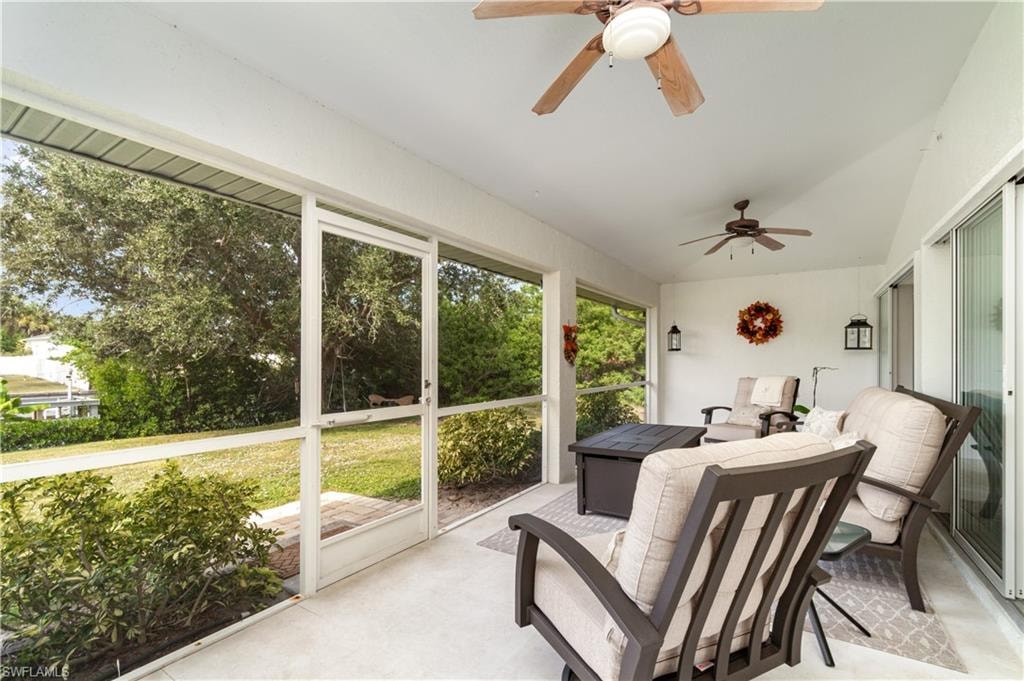 Sunroom / solarium with healthy amount of natural light and ceiling fan