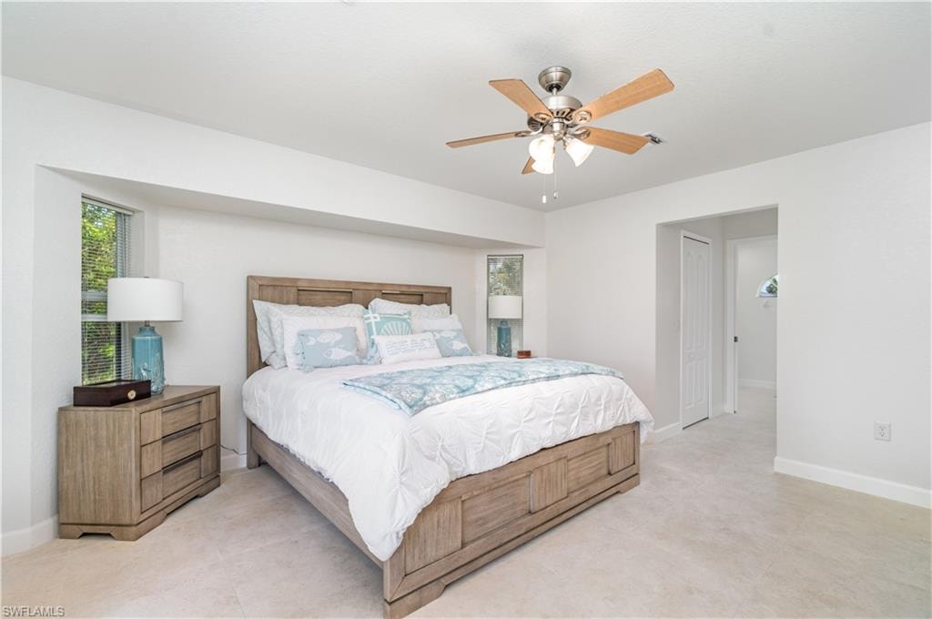 Bedroom featuring a closet and a ceiling fan