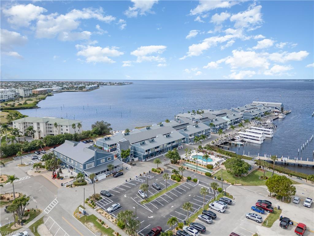 Bird's eye view of a nearby body of water and numerous boat docks