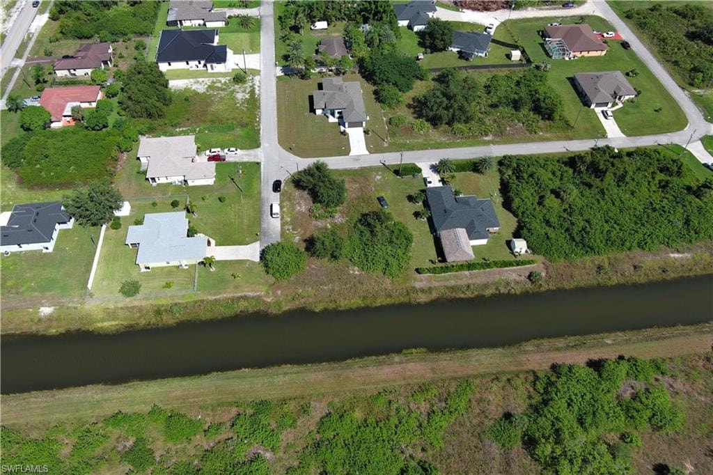 View of property location with nearby suburban area and a large body of water