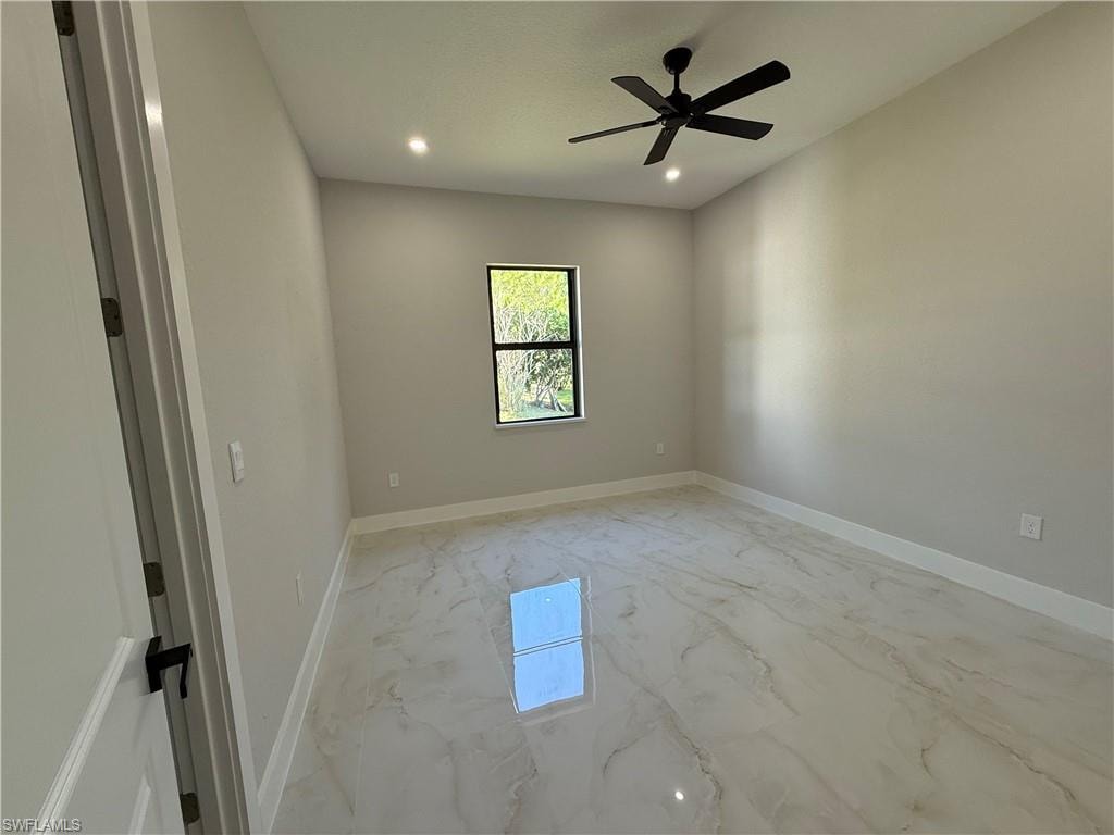 Spare room featuring light marble finish flooring, recessed lighting, and ceiling fan