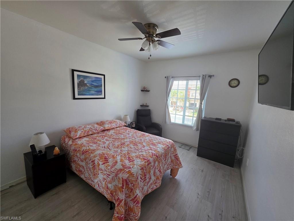 Bedroom featuring light wood finished floors and ceiling fan