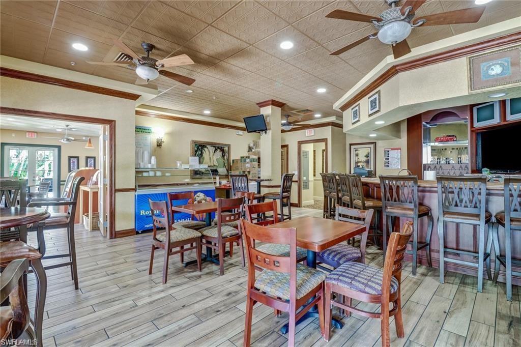 Dining area featuring recessed lighting, ceiling fan, light wood-style floors, and ornamental molding