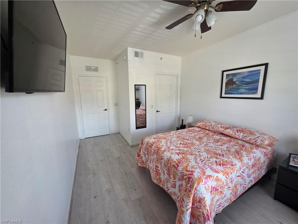Bedroom featuring wood finished floors and ceiling fan