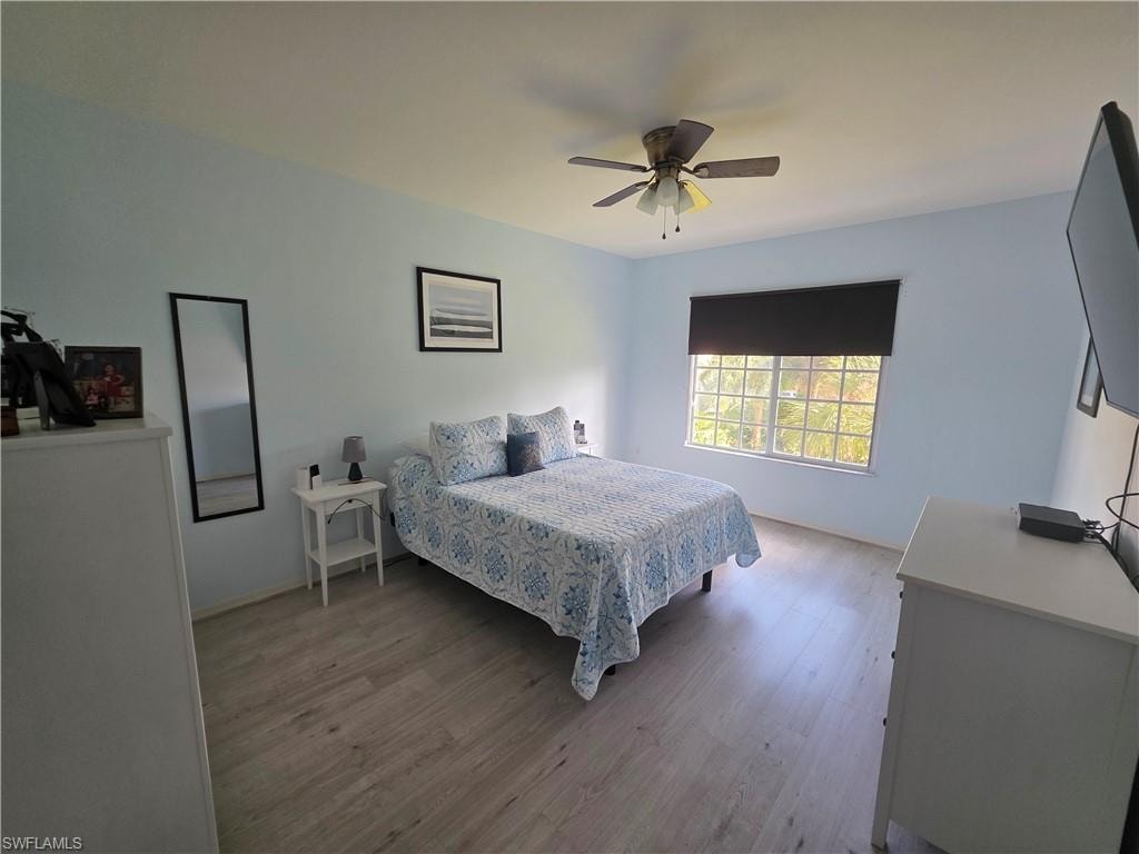 Bedroom featuring light wood-type flooring and ceiling fan
