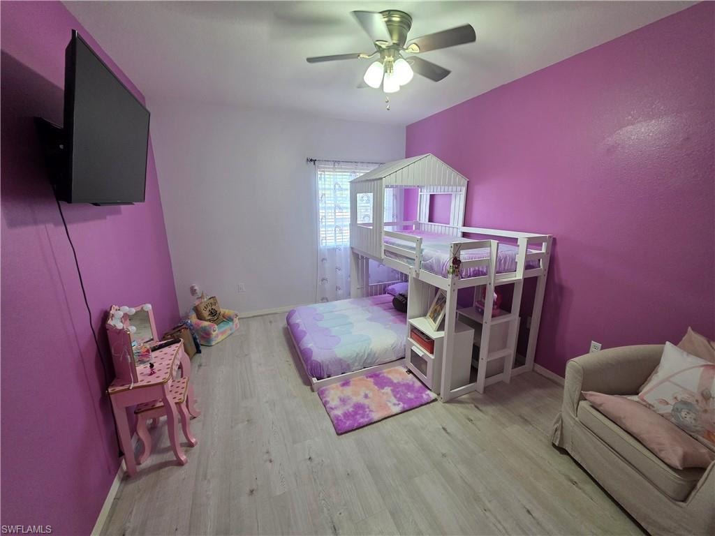 Bedroom featuring light wood-style floors and ceiling fan