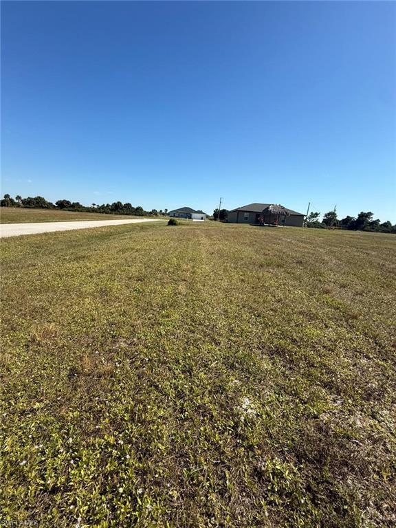 View of grassy yard featuring a view of rural / pastoral area