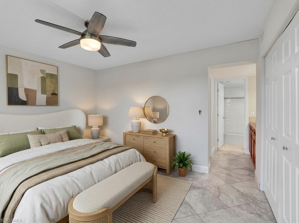 Virtual Staged Bedroom featuring a ceiling fan with integrated lighting, light gray wall paint, and gray marble-look tile flooring
