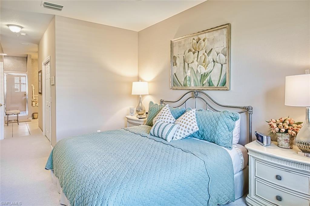 Carpeted bedroom with a closet