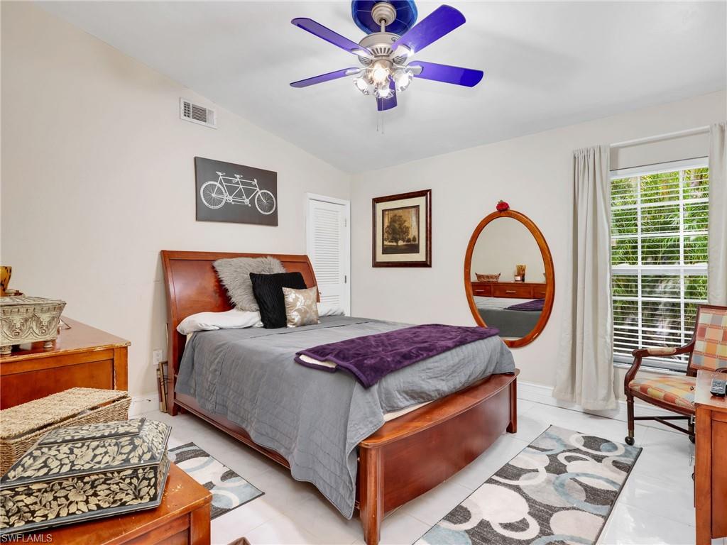 Bedroom featuring lofted ceiling and ceiling fan