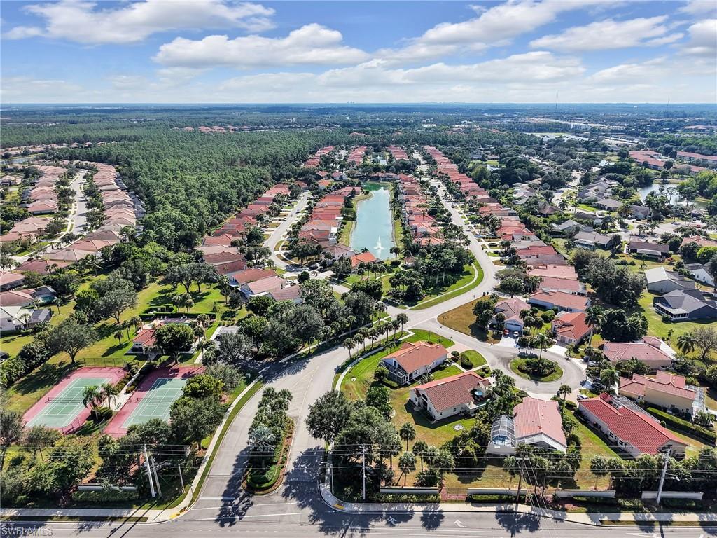 Aerial view of entrance to subdivision and lake.