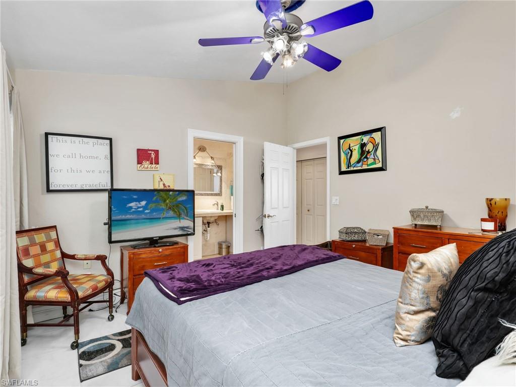 Bedroom with vaulted ceiling and ceiling fan