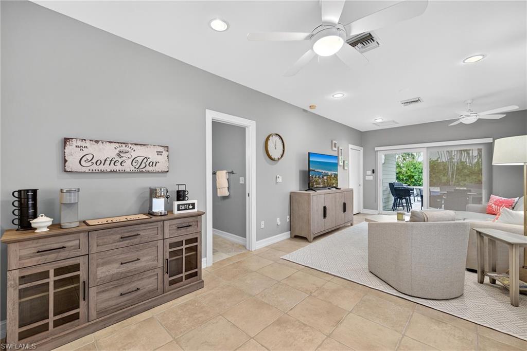Living area with ceiling fan and recessed lighting