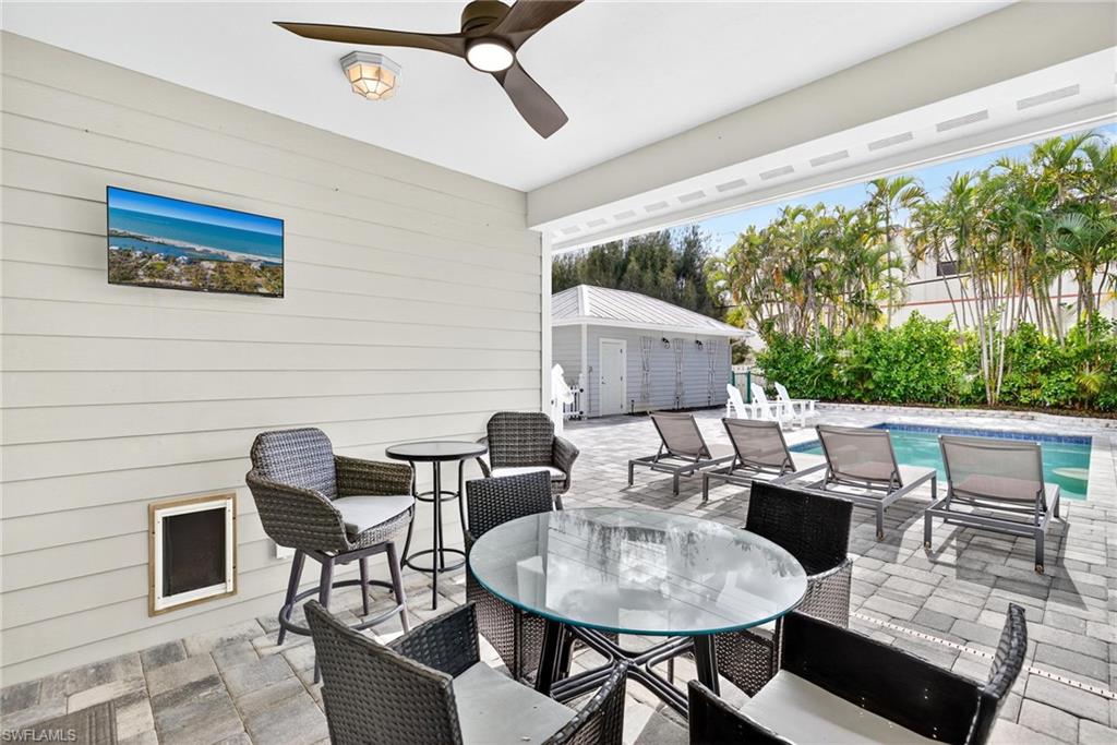 View of patio / terrace with outdoor dining area and a ceiling fan