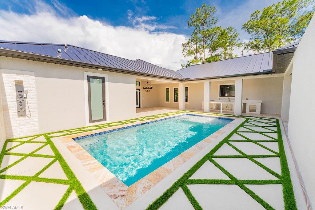 Swimming pool with a patio