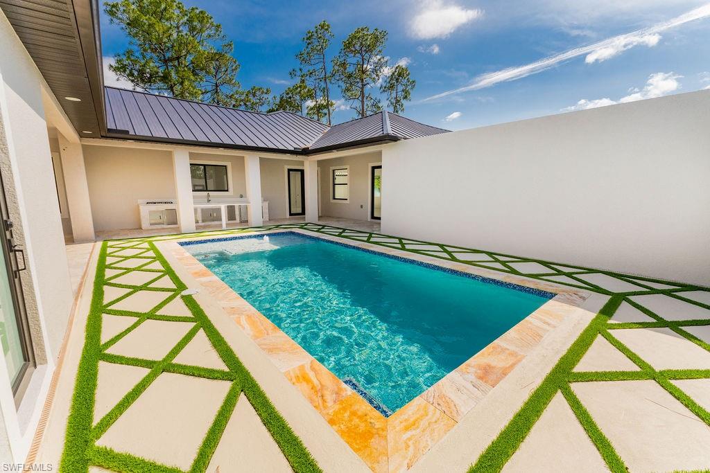Outdoor pool with a patio area