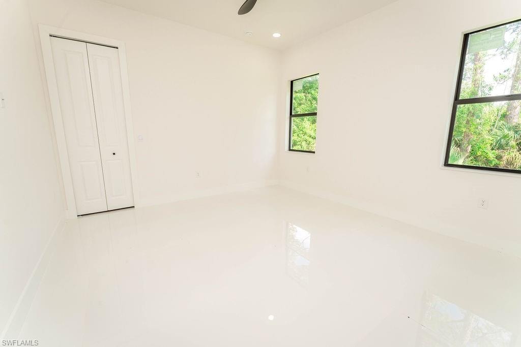 Unfurnished room with recessed lighting and a ceiling fan