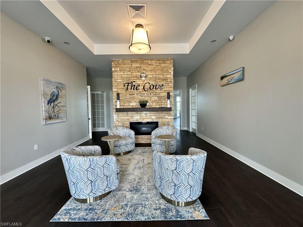 Sitting room featuring a brick fireplace