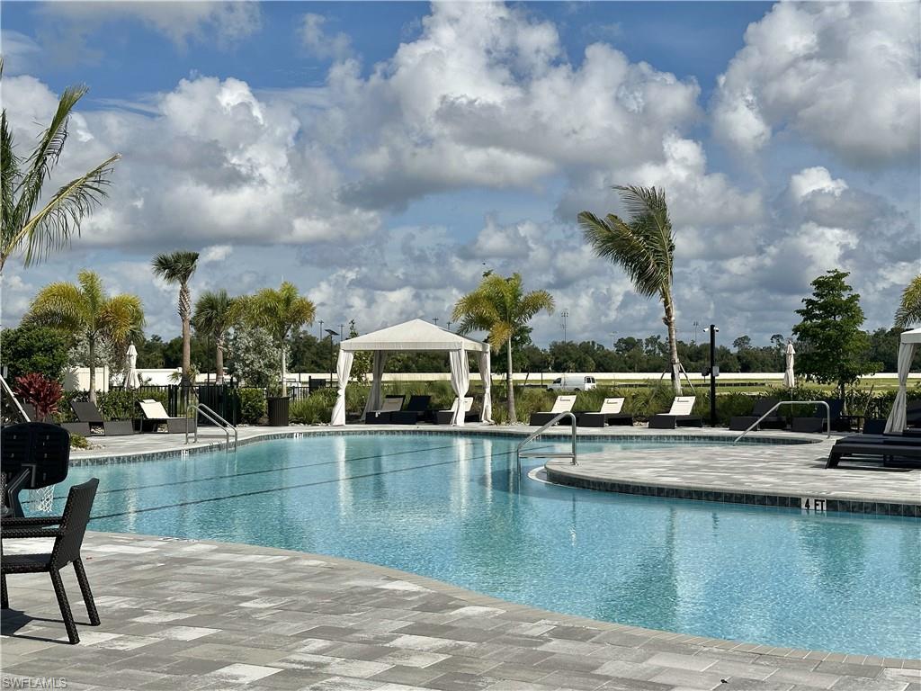 Community pool featuring a gazebo and a patio area