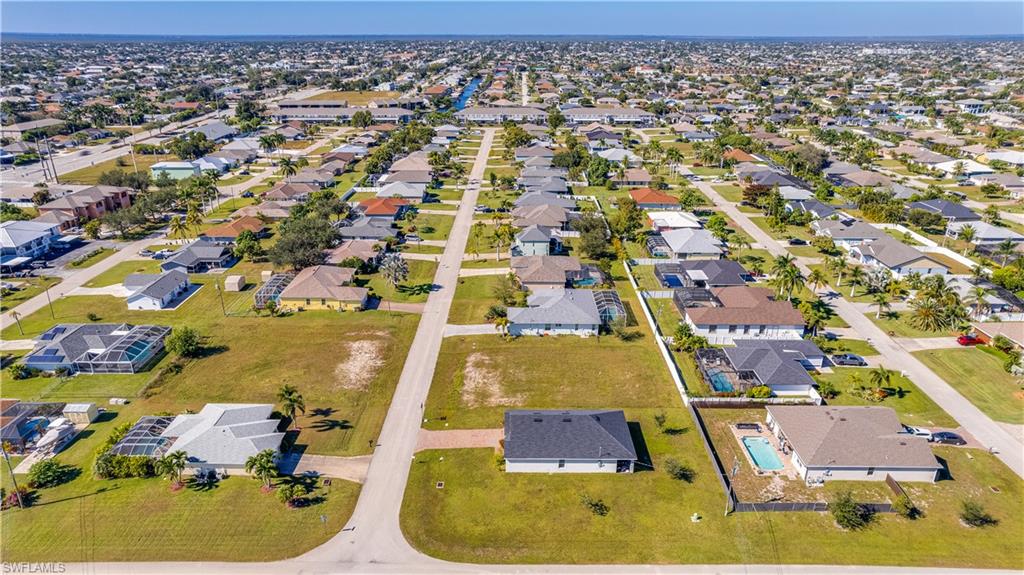 Aerial overview of property's location with nearby suburban area