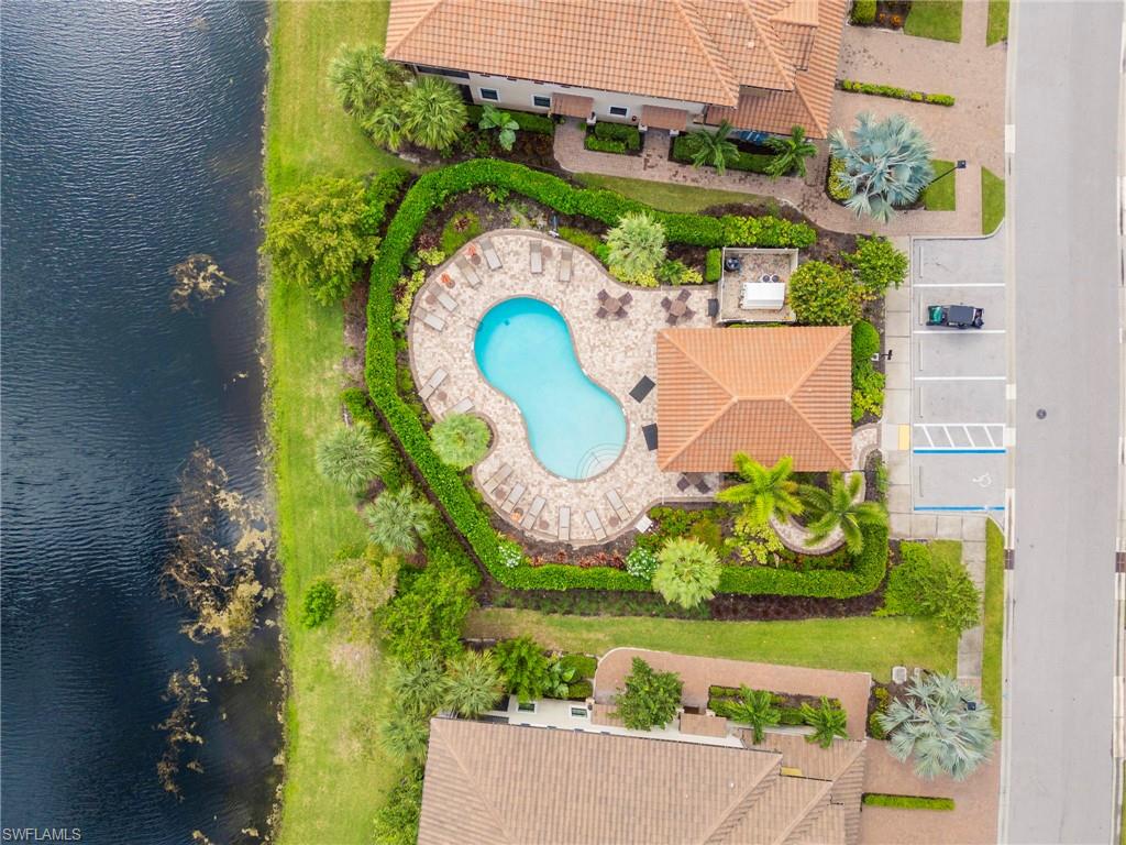 Drone / aerial view of a large body of water and a pool