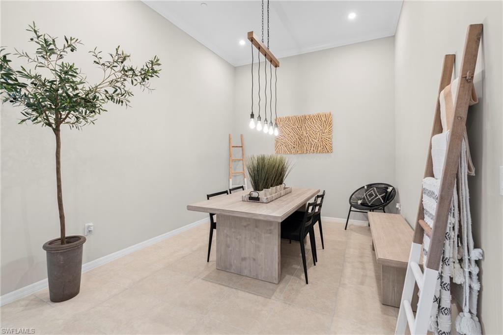 Office area featuring recessed lighting and crown molding