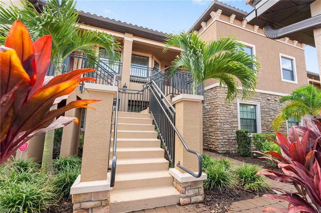 View of property featuring stairway