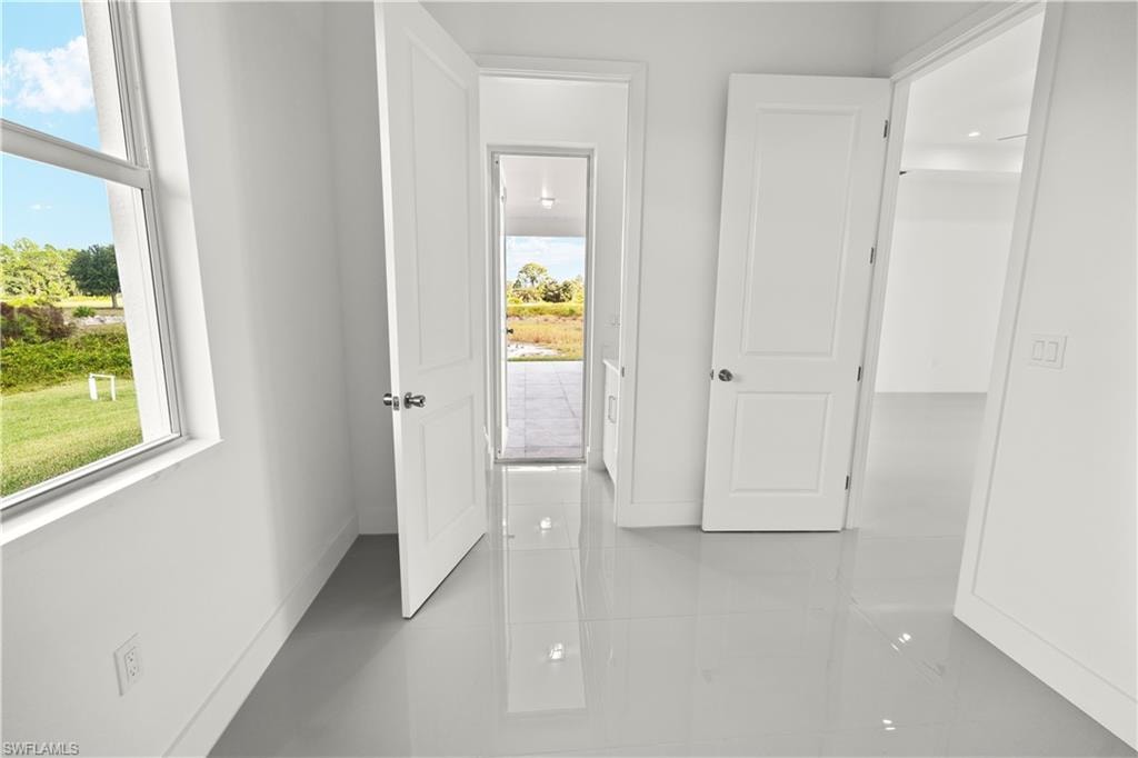 Corridor featuring baseboards