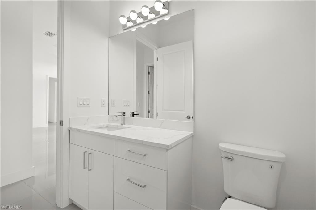 Bathroom featuring vanity and light tile patterned floors