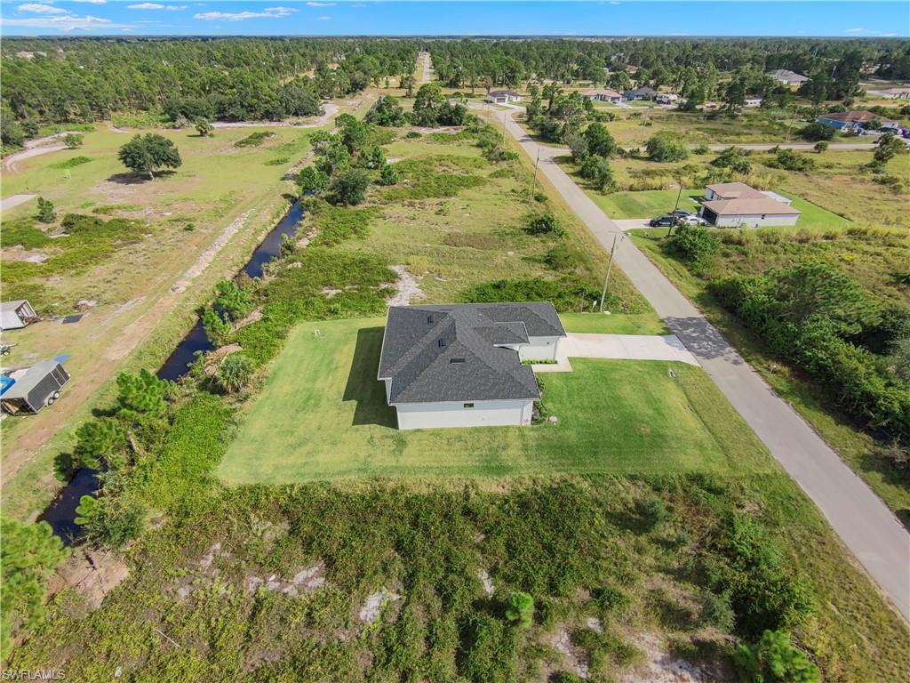 Aerial view of property and surrounding area with rural landscape