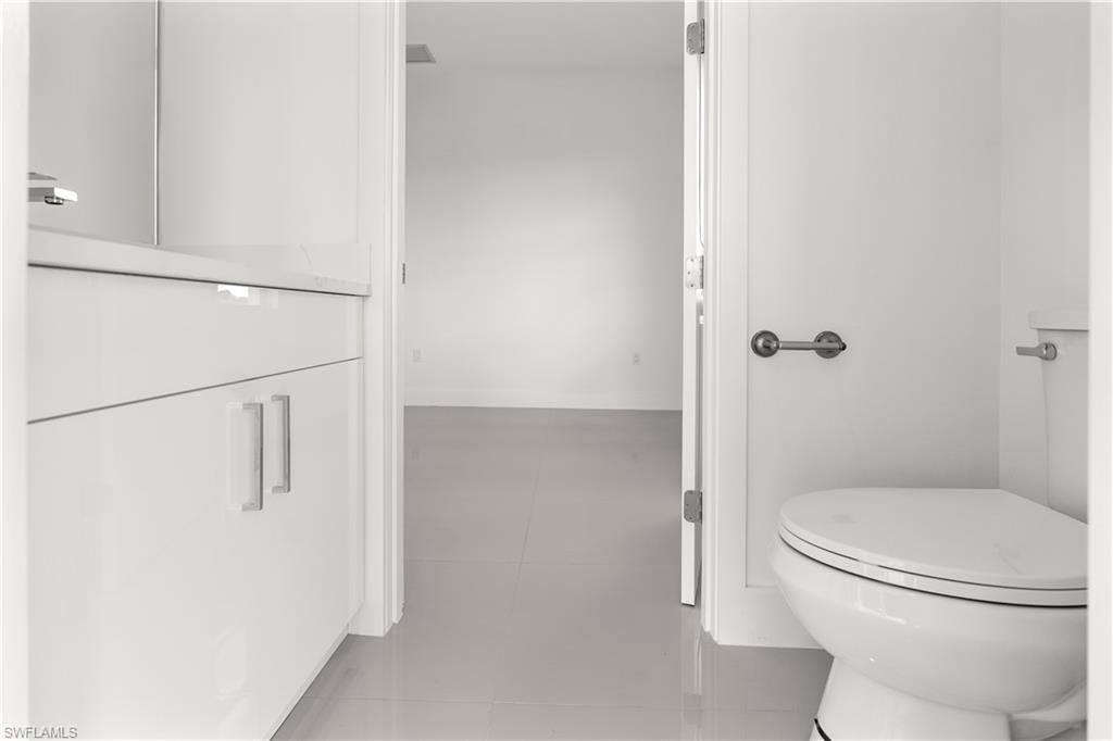 Bathroom featuring toilet and baseboards