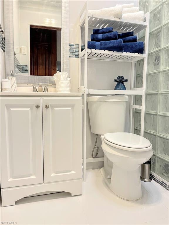 Bathroom featuring light tile patterned floors and vanity