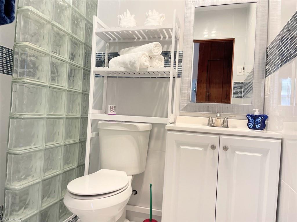 Bathroom featuring vanity and a walk in shower