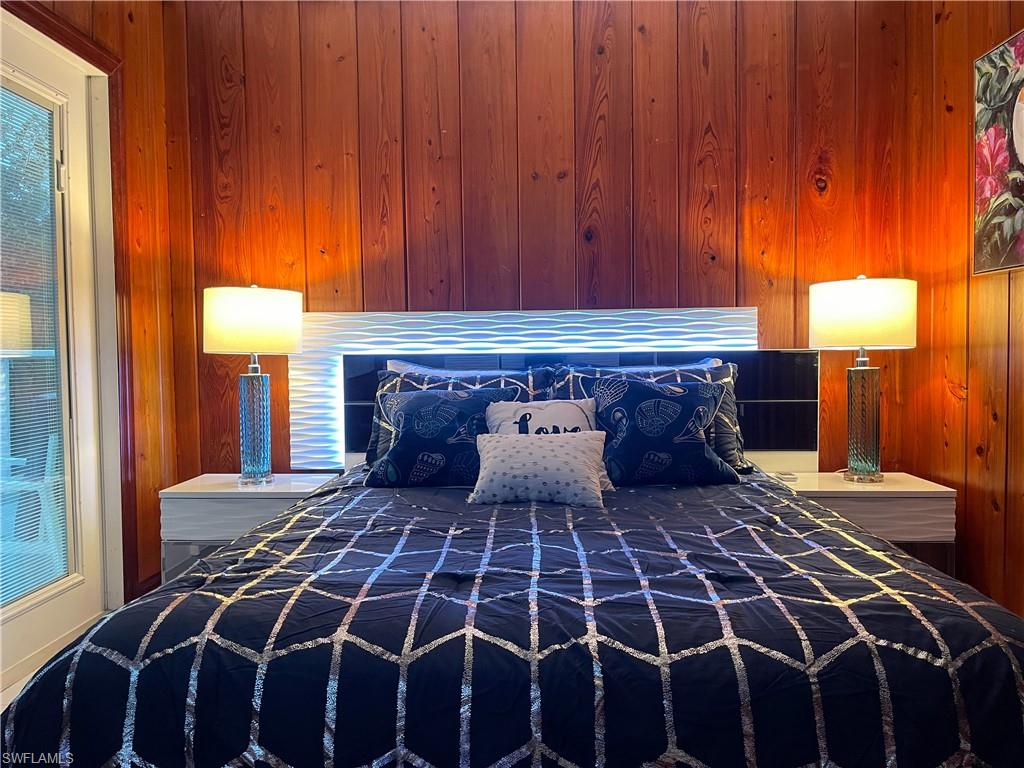 Bedroom with wooden walls