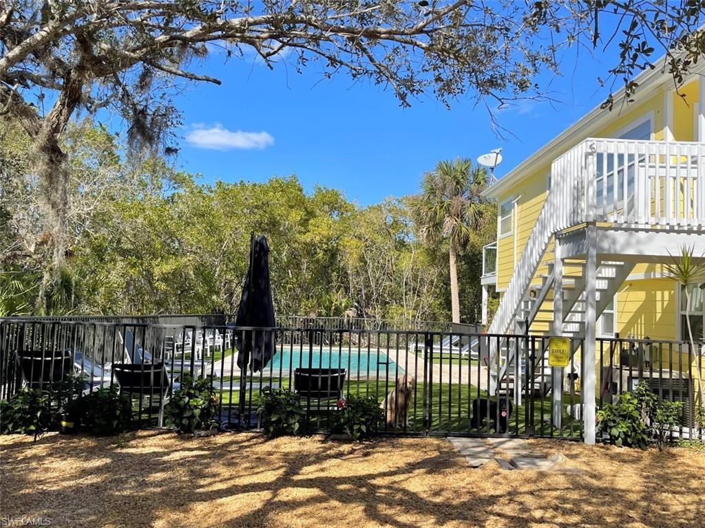 View of yard with stairway and view of scattered trees