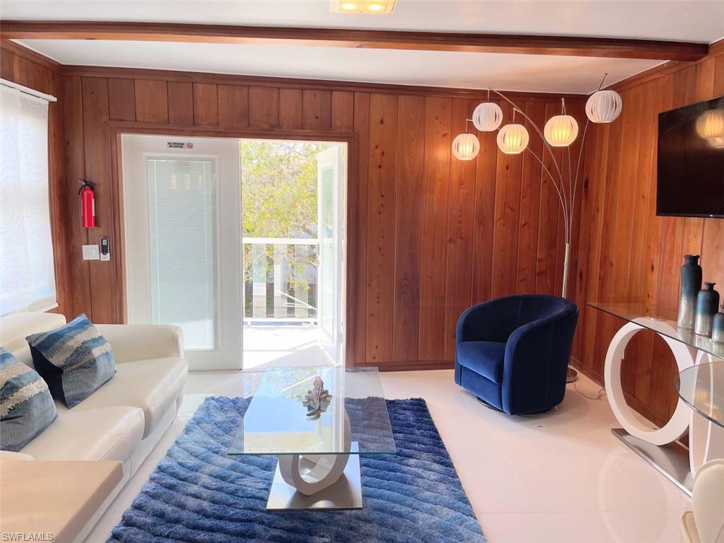 Tiled living room with wood walls