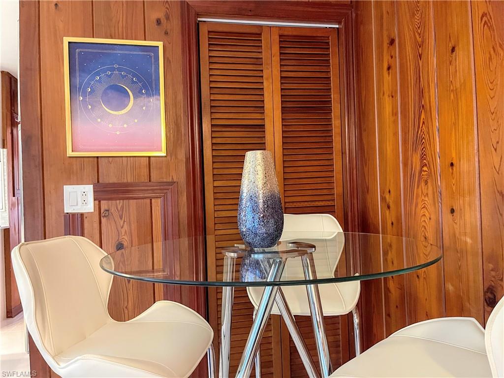 Dining space with wooden walls