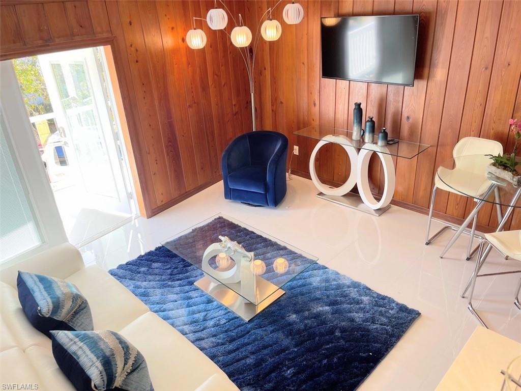 Sitting room with wood walls