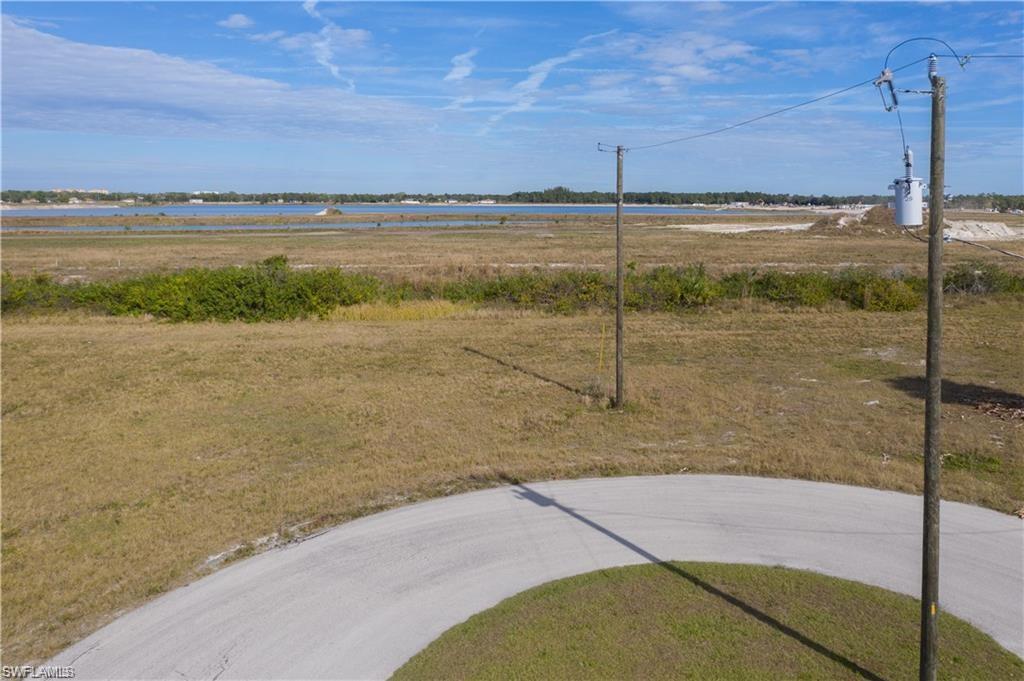View of yard with a water view