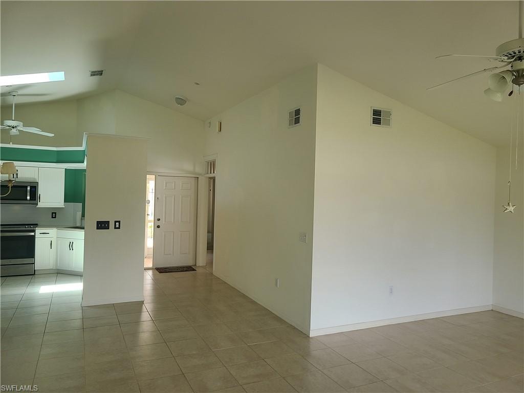 view of hallway, kitchen, and living room