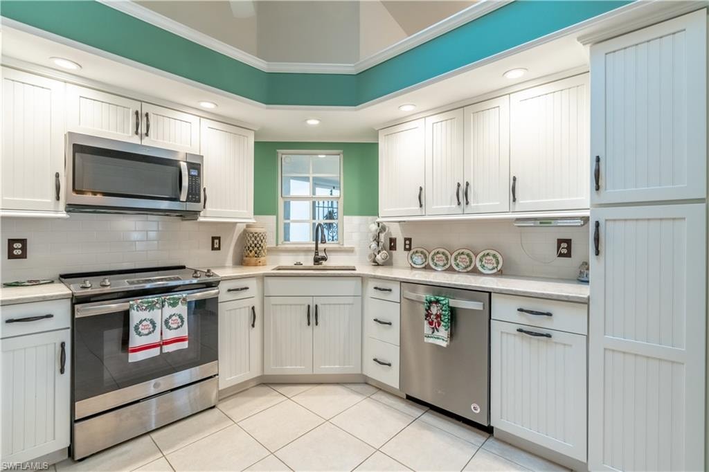 Kitchen featuring appliances and window overlooking the front porch