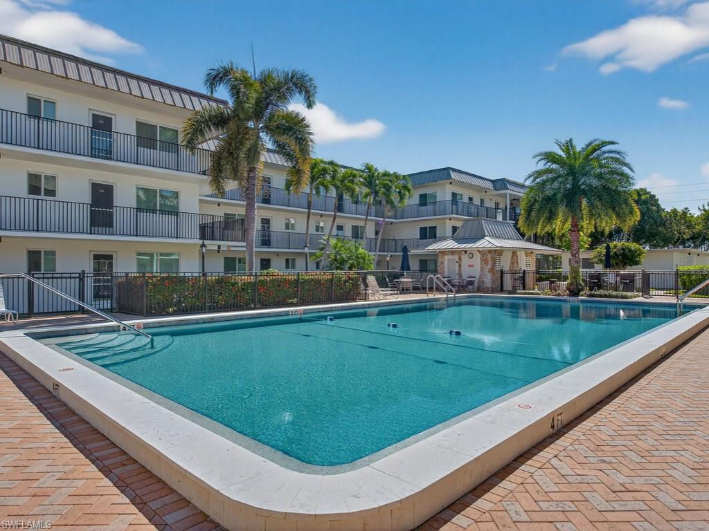 Community pool with a patio area