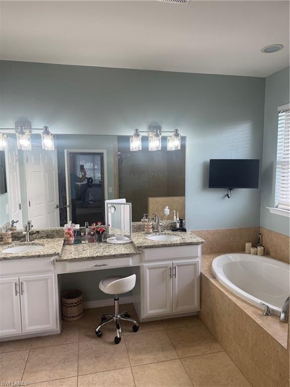 Master bathroom with double vanity, tub and walk in shower
