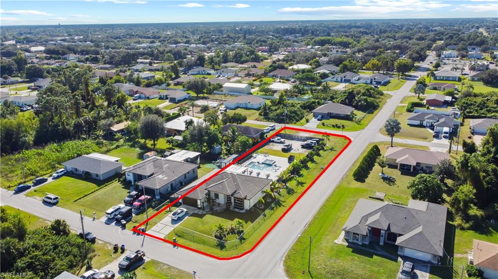 Aerial view of residential area with property boundaries highlighted