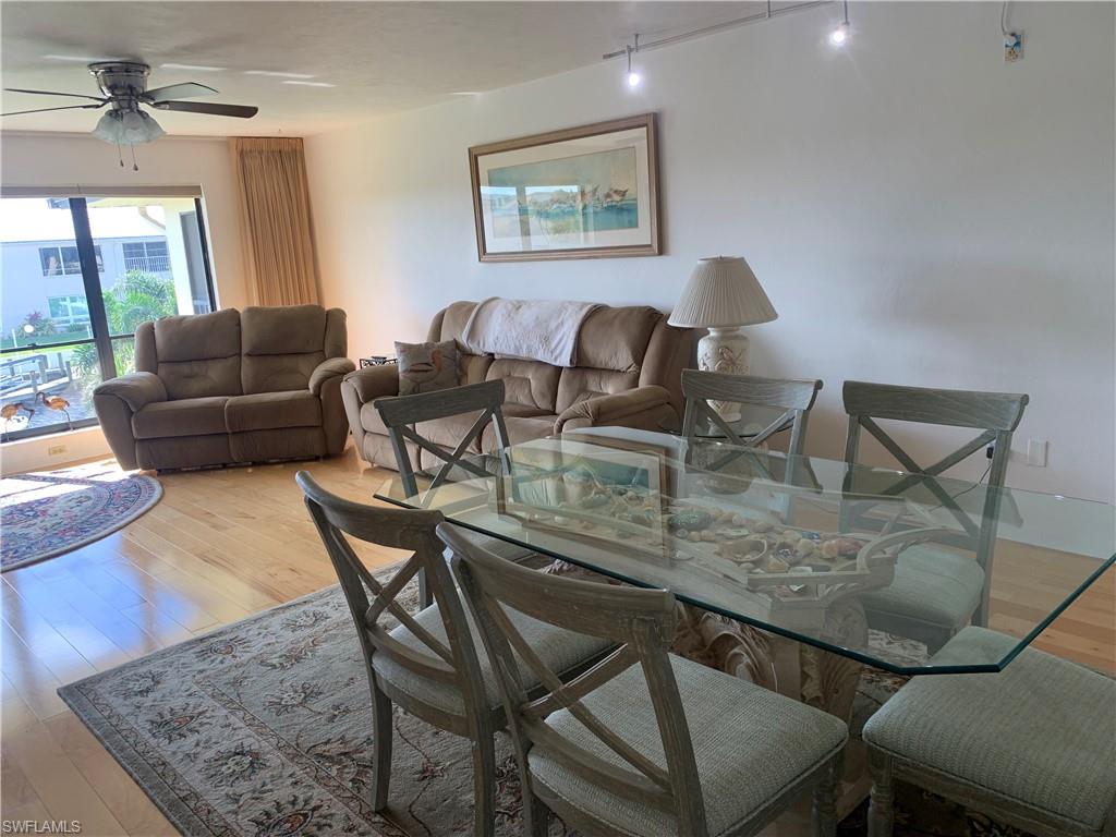Dining space featuring ceiling fan and light hardwood / wood-style floors