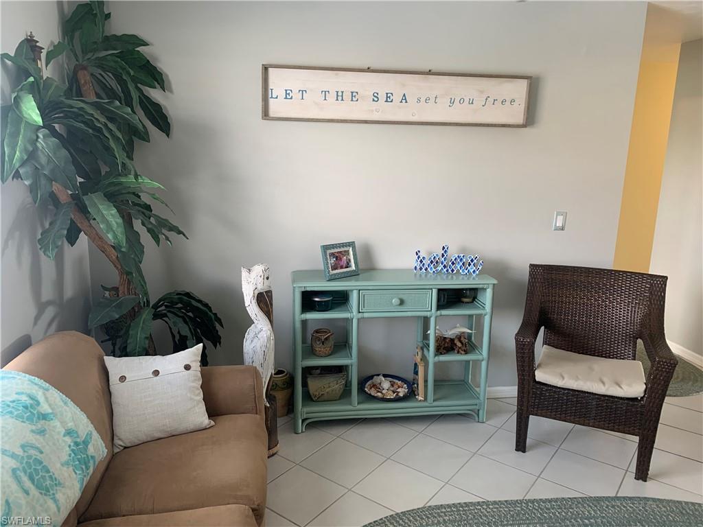 Living area featuring tile patterned flooring