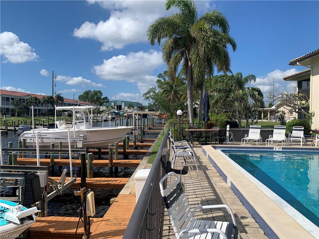 View of pool with a boat dock